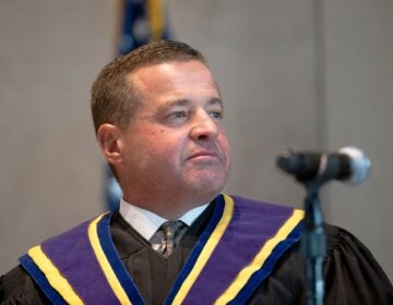 David N. Wecht looks on