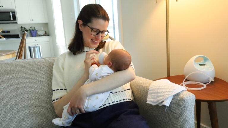 Kara McPeak holds her nearly 4-week-old son