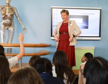 Maureen Krouse gives an anatomy lesson to sixth-grade students