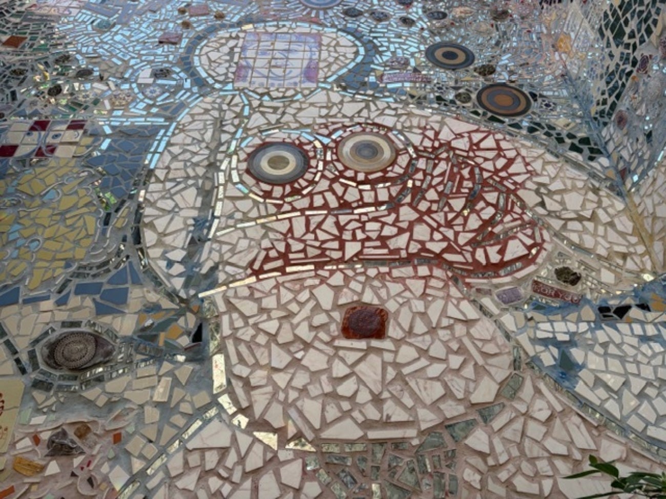 An Isaiah Zagar mosaic of Julia Zagar inside the Magic Gardens