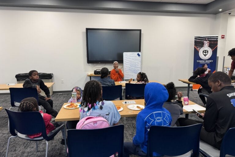 NAMI youth peer navigator Ashley Murray working with workshop attendees