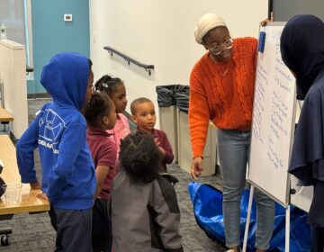 NAMI youth peer navigator Ashley Murray working with workshop attendees