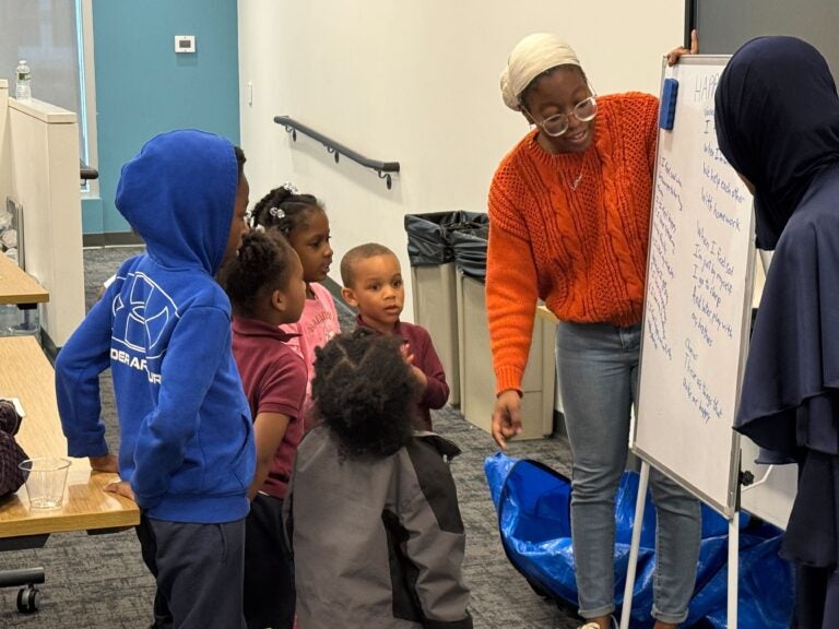 NAMI youth peer navigator Ashley Murray working with workshop attendees