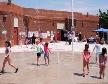 Children play outside a polling place at the East Passyunk Community Center in Philadelphia, Tuesday, May 19, 2026.