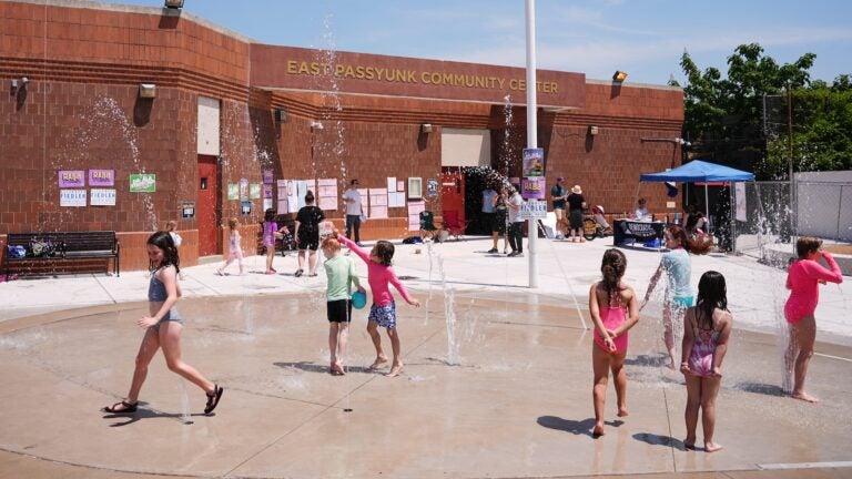 Children play outside a polling place at the East Passyunk Community Center in Philadelphia, Tuesday, May 19, 2026.