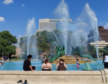 People cool off at Swann Memorial Fountain in Philadelphia's Logan Square on May 18, 2026.
