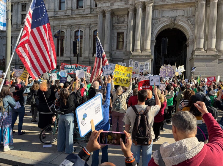 Unions and labor activists rally at City Hall to commemorate Mayday