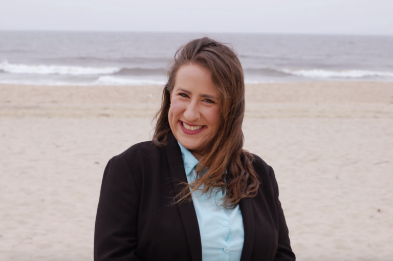Rachel Peace poses for a photo in front of the Ocean