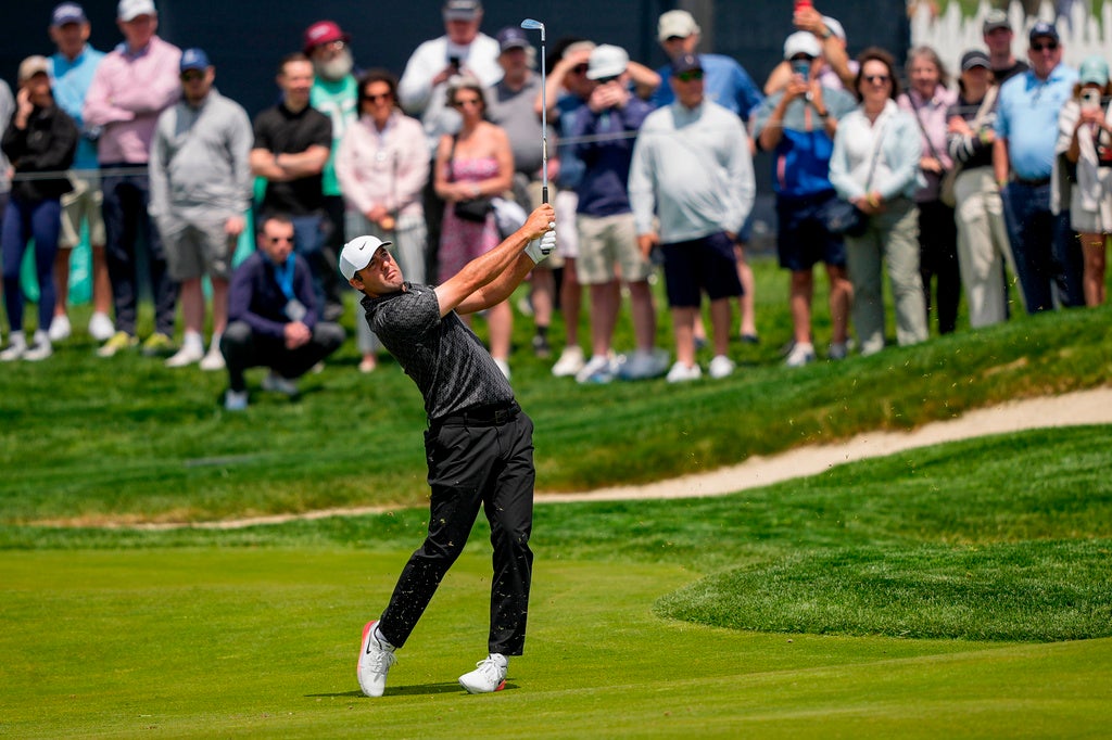Scottie Scheffler hits from the 11th fairway during a PGA Championship golf tournament practice round