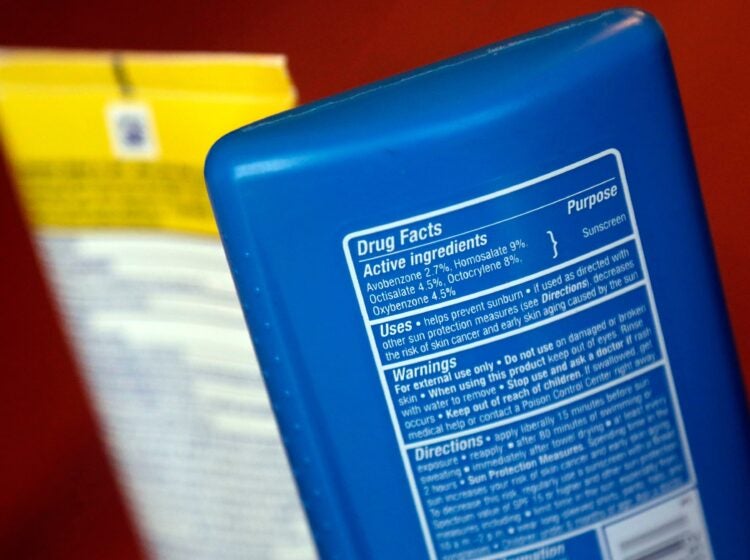 sunscreen ingredients are shown on two bottles
