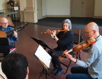 Gwyn Roberts, center, rehearses 
