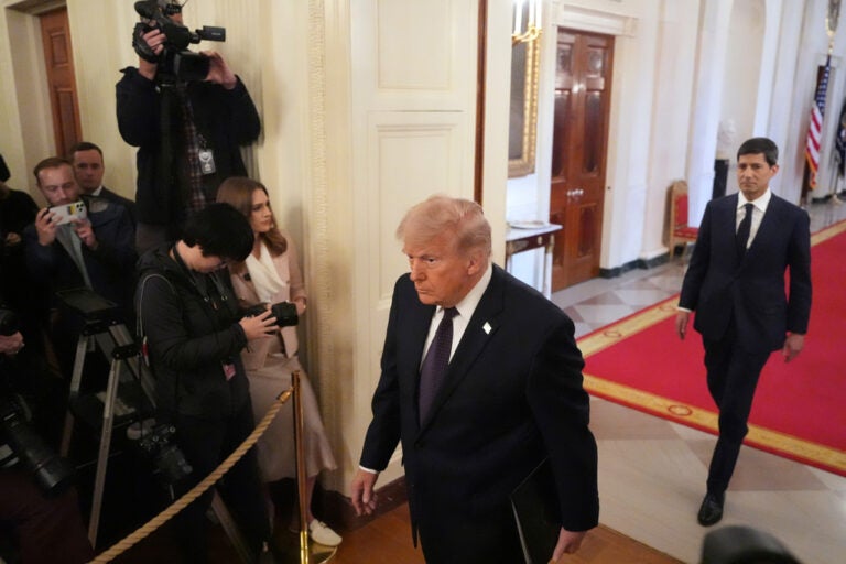President Donald Trump, left, and Kevin Warsh arrive at a swearing-in ceremony for Warsh as Chairman of the Federal Reserve in the East Room of the White House