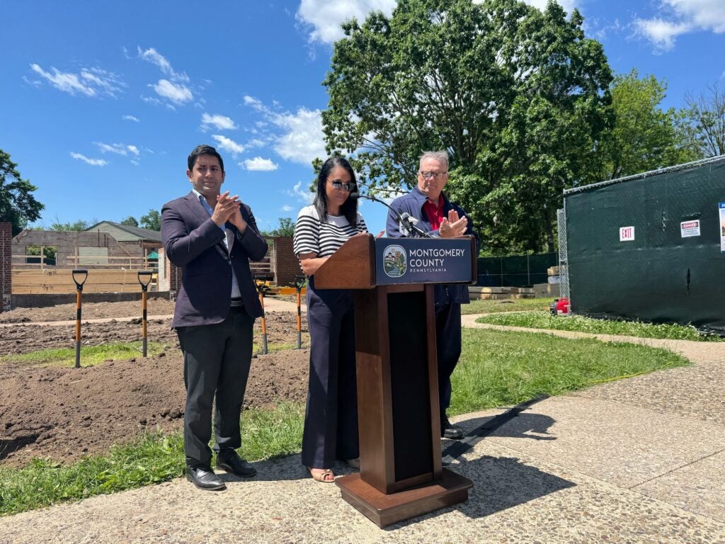 Jamila Winder speaking at a podium