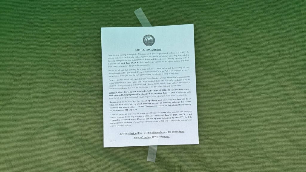 An eviction notice on a tent at a Wilmington homeless encampment