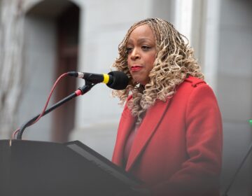 Jamie Gauthier speaking at a podium