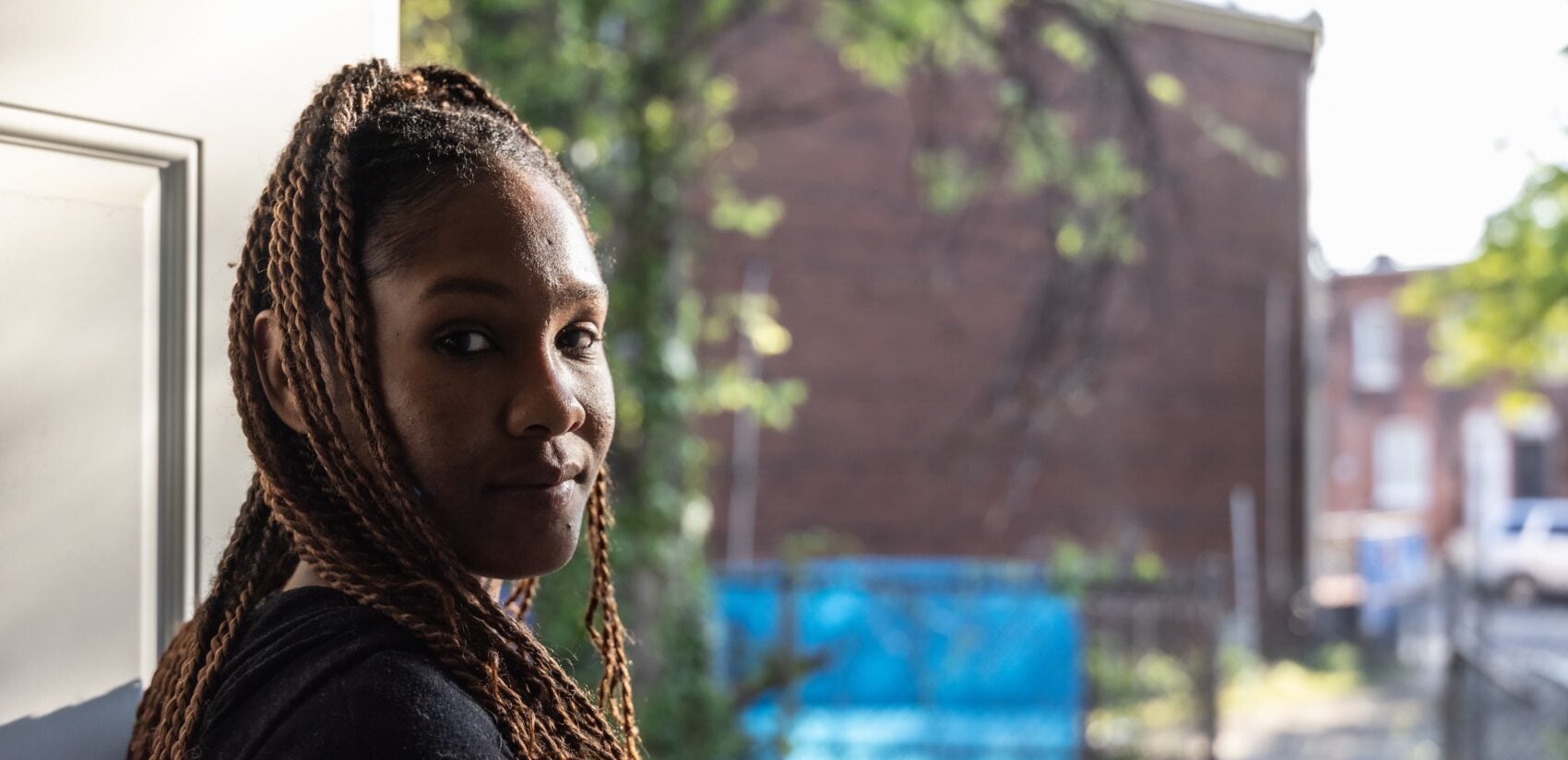 Christina Allen at her back door in Camden’s Waterfront South neighborhood