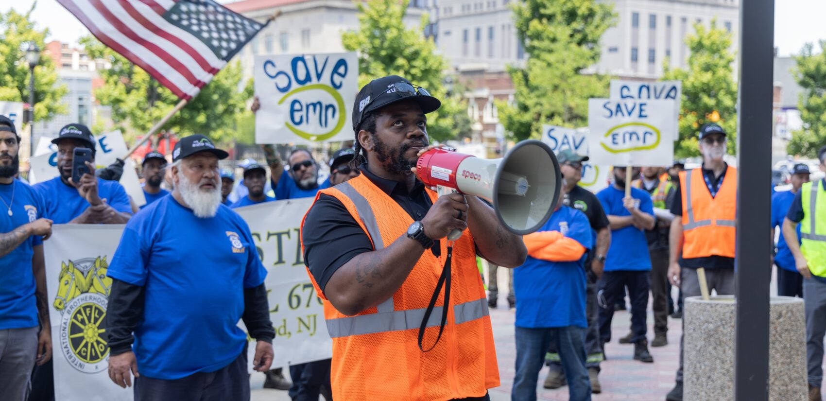 Kareem Anderson speaking into a megaphone at a protest.