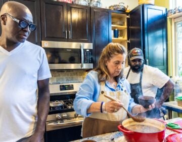 WHYY asked 3 Black chefs to create their best pepper pot soup recipe and recorded the reactions. From left: Chef Shola Olunloyo, owner of Studio Kitchen; Chef Angie Brown; Chef Omar Tate, co-owner at Honeysuckle. (Kimberly Paynter/WHYY)