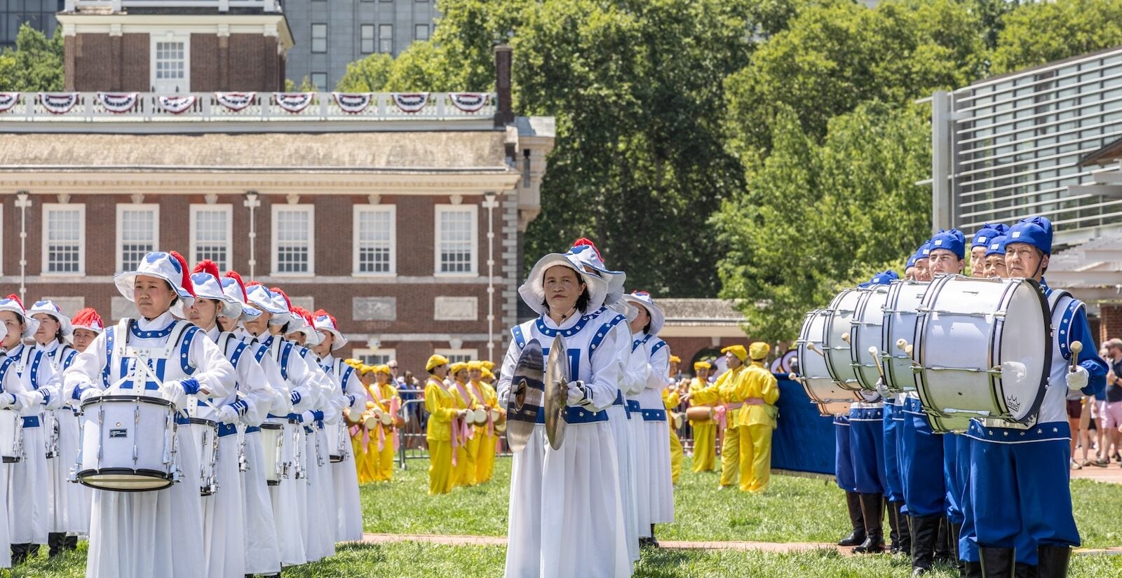 A marching band performs on Independence Mall on July 3, 2026