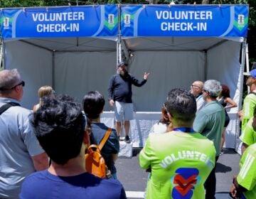 Brad Page gives instructions to FIFA Fan Festival volunteers