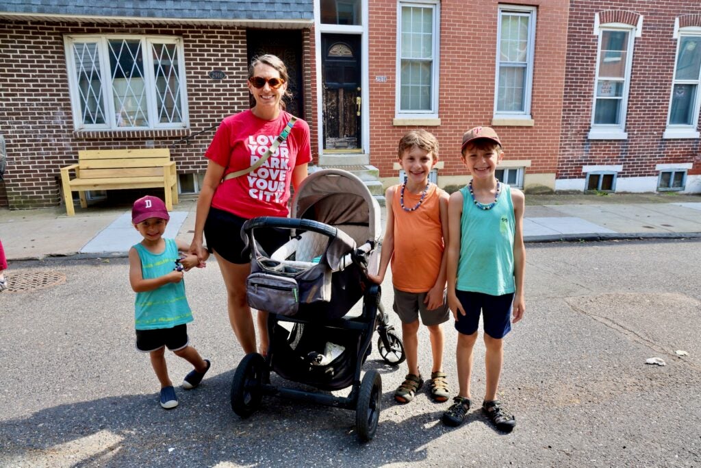 Liz Diretto poses for a photo with her children.