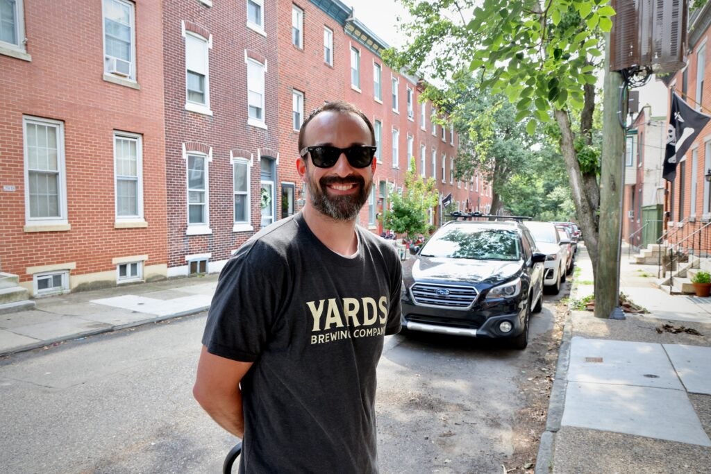 Nick Kapsimalis poses for a photo in the street.