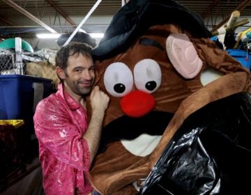 Rose Jarboe of the Bearded Ladies Cabaret cuddles a Mr. Potato Head costume