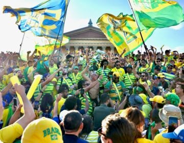 2026 06 18-e lee-philadelphia museum of art-brazil fans rally flags Brazilian fans rally on the steps of the Art Museum.