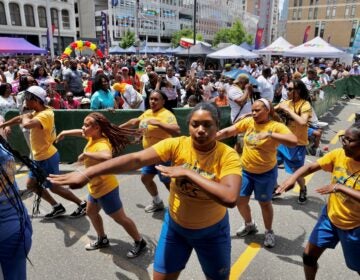 2026 06 19-e lee-philadelphia african american museum-juneteenth block party west powelton steppers Performers dancing in the street during the celebration.