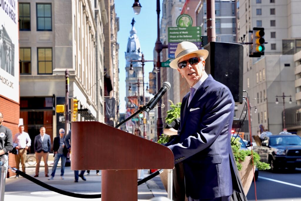 Carl Dranoff speaks at a ceremony celebrating the completion of a new plant-filled median on South Broad Street between Spruce and Pine streets