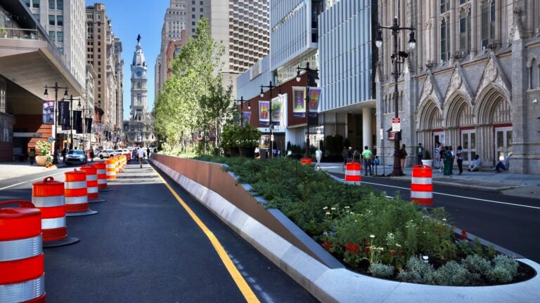 A block of South Broad Street in Philadelphia, between Spruce and Pine streets, is seen with a raised median filled with plantings