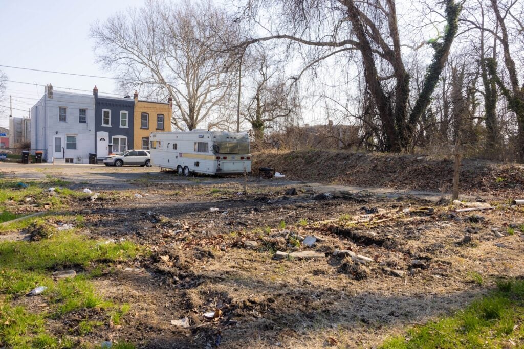A vacant lot filled with trash.