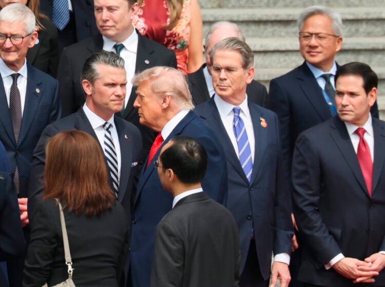 U.S. President Donald Trump looks on next to, from bottom right, U.S. Secretary of State Marco Rubio, U.S. Treasury Secretary Scott Bessent, U.S. Defense Secretary Pete Hegseth, Nvidia CEO Jensen Huang, top right, Tesla CEO Elon Musk, Apple CEO Tim Cook, top left, and others during a welcome ceremony at the Great Hall of the People in Beijing, Thursday, May 14, 2026. (Maxim Shemetov/Pool Photo via AP)