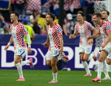 Croatia's Nikola Vlasic (13) celebrates with teammates after scoring his side's second goal