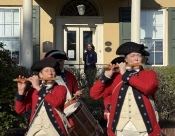 Bell 2 Revolutionary War reenactors play various instruments