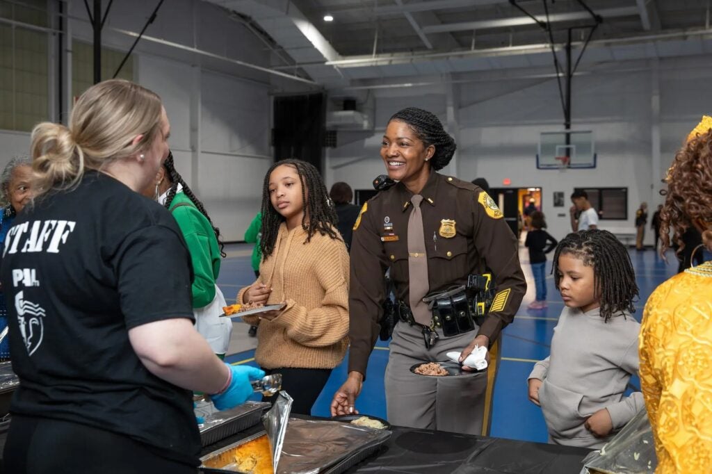Police officers helping with a program for the children.