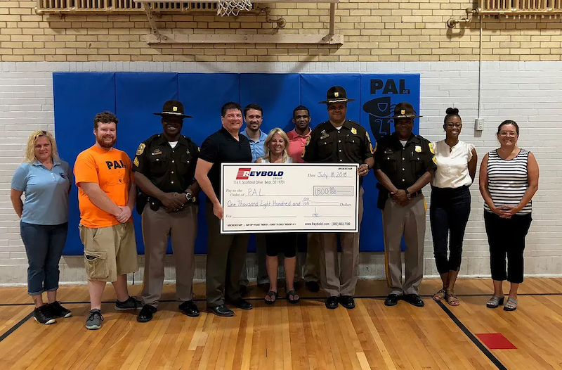 Longhurst accepting an oversized check.