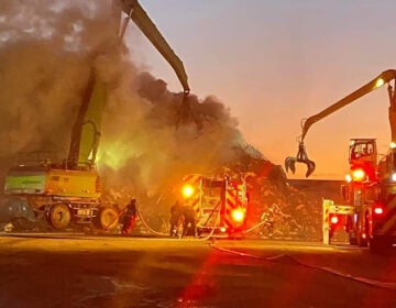 Firefighters working at the scene of a fire.