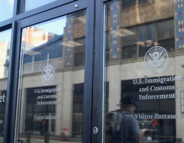 A glass door with the U.S. Immigration and Customs Enforcement logo and title on it in Philadelphia