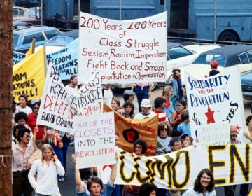Sin-Colonias-200-class-struggle-1976-march A group of people hold various signs about class struggles during a protest in 1976.