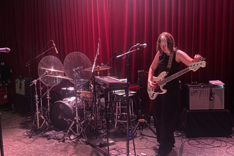 Ainjel Emme tunes her bass