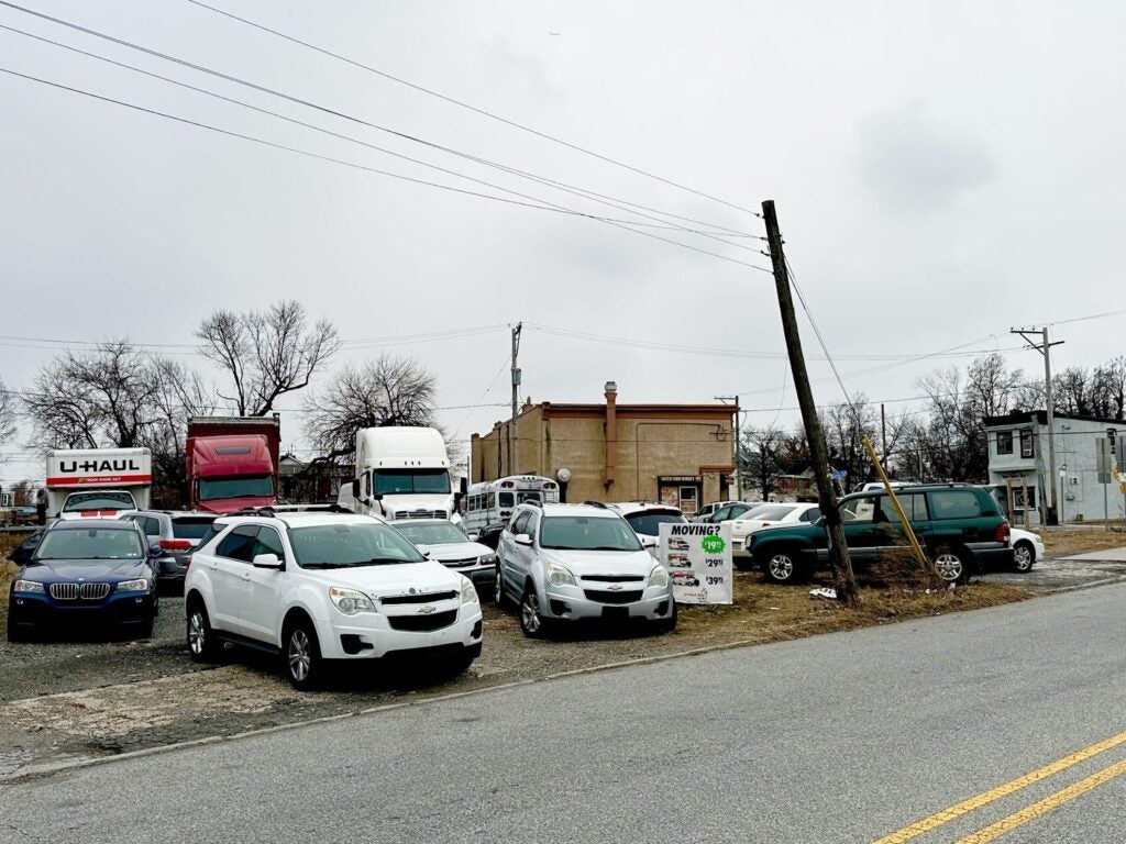 U-Haul vans sitting in a lot.