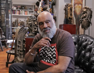 danny-simmons-e-lee-bp-2026-06-16 Danny Simmons posing for a photo surrounded by artifacts.