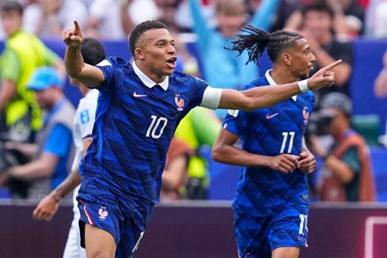 France's Kylian Mbappe (10) celebrates after scoring his team's first goal