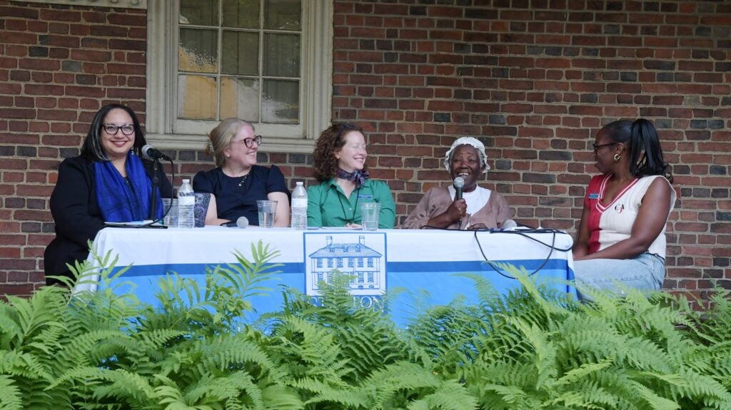 Five women sitting at a table as panelists.