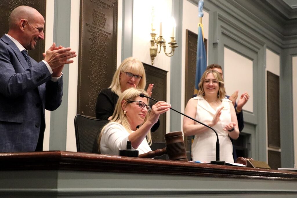 Longhurst being applauded in the General Assembly