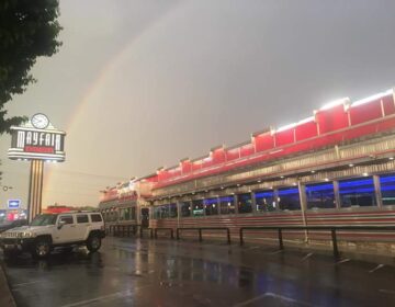 A rainbow appears over the Mayfair Diner