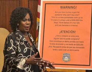 mayor-cherelle-parker-gun-straw-purchase-regulations-2025-09-08 Cherelle Parker speaking at a press conference in front of a poster outlining new gun regulations.