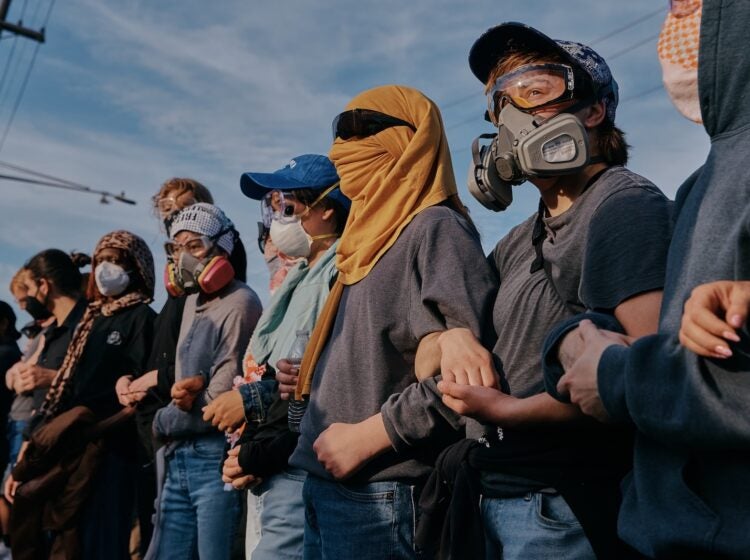 Protesters confront ICE agents outside the Delaney Hall detention center while demonstrating near the entrance gates, Wednesday, May 27, 2026, in Newark, N.J.