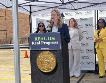 Mikie Sherrill speaking at a podium during a press conference